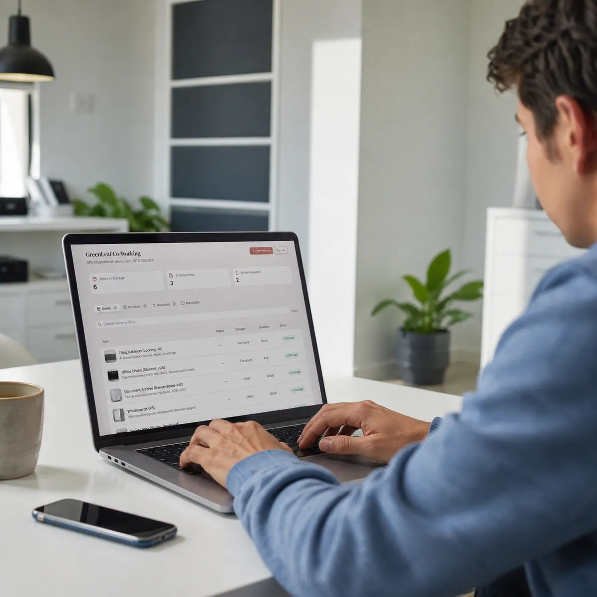 Storage customer reviewing their stored items, invoices, and requests in a self-storage customer portal on a laptop